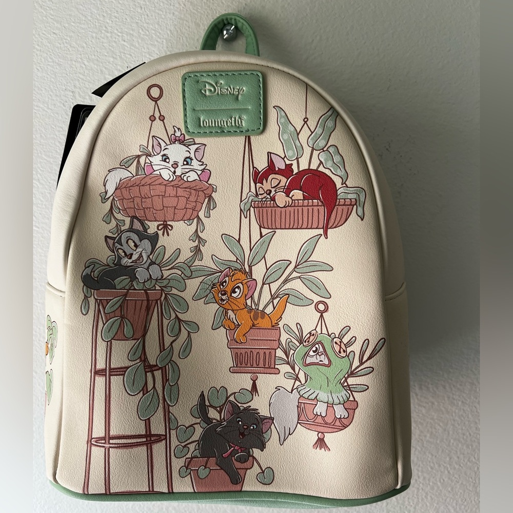 Loungefly Disney cats Cream Mini Backpack with Pastel Green Trim.